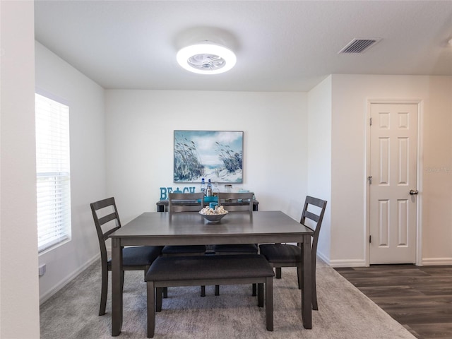 dining area featuring dark hardwood / wood-style floors