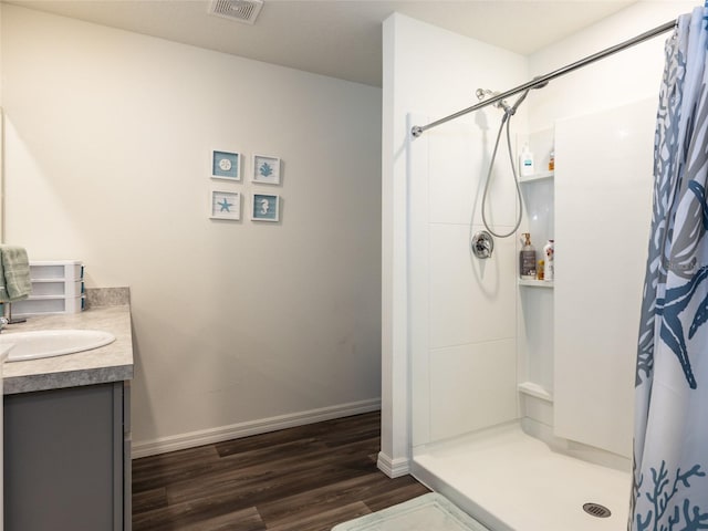 bathroom with vanity, hardwood / wood-style floors, and a shower with curtain