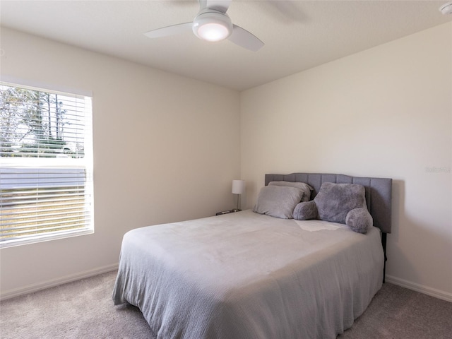 bedroom with light colored carpet and ceiling fan