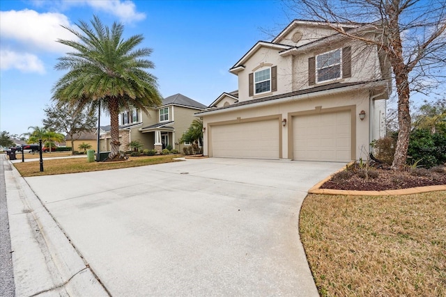 view of front property with a garage and a front yard