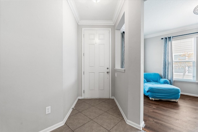 hallway featuring light tile patterned floors and ornamental molding