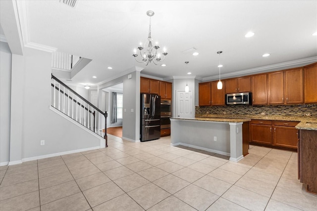 kitchen with appliances with stainless steel finishes, light stone counters, a kitchen island, decorative light fixtures, and light tile patterned flooring