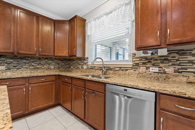 kitchen with ornamental molding, sink, stainless steel dishwasher, and light stone counters