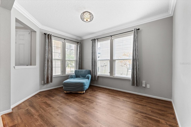 unfurnished room with crown molding, dark wood-type flooring, and a textured ceiling