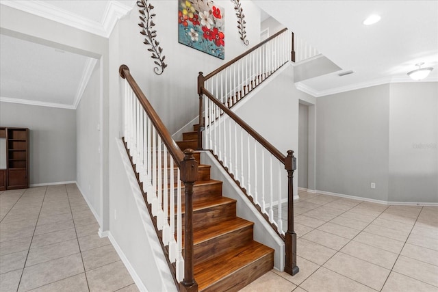 staircase featuring crown molding and tile patterned floors