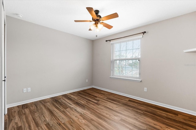 spare room with hardwood / wood-style floors and ceiling fan