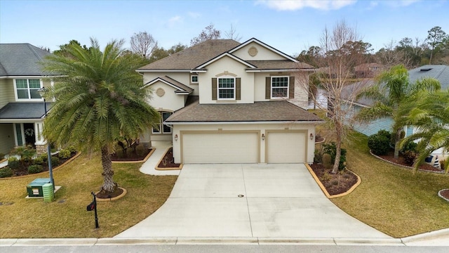 view of front facade featuring a garage and a front yard