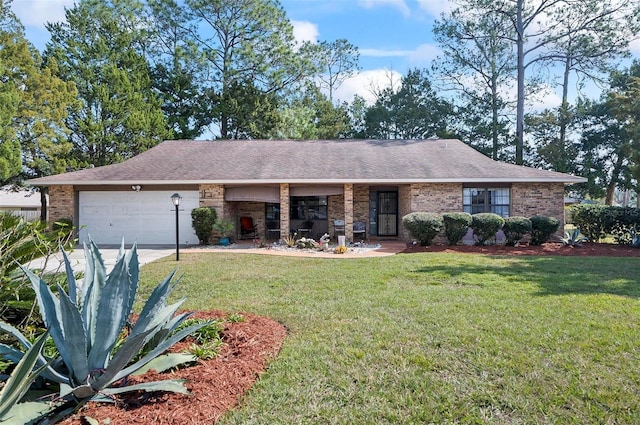 ranch-style home with a garage and a front yard