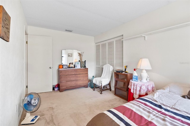 carpeted bedroom with a closet