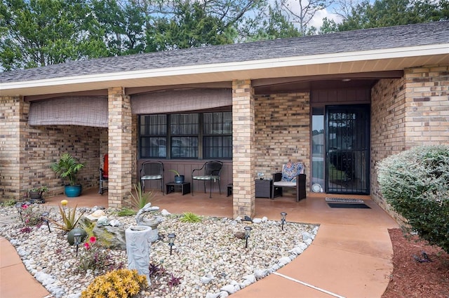 entrance to property featuring a patio