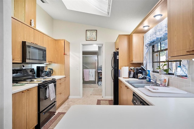 kitchen featuring sink, decorative backsplash, vaulted ceiling, and black appliances