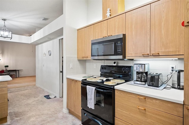 kitchen with light brown cabinetry, black range with electric cooktop, a notable chandelier, pendant lighting, and backsplash