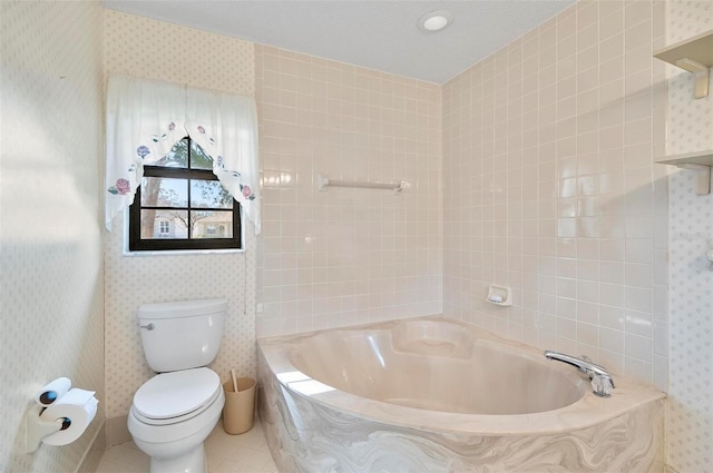 bathroom with toilet, a bathing tub, and tile patterned flooring