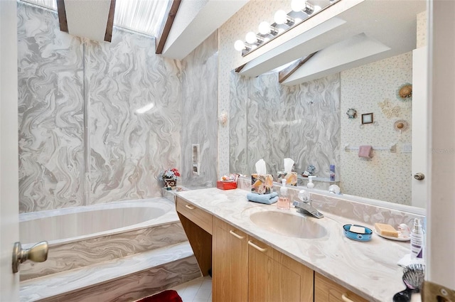 bathroom with tile patterned floors, vanity, and a tub