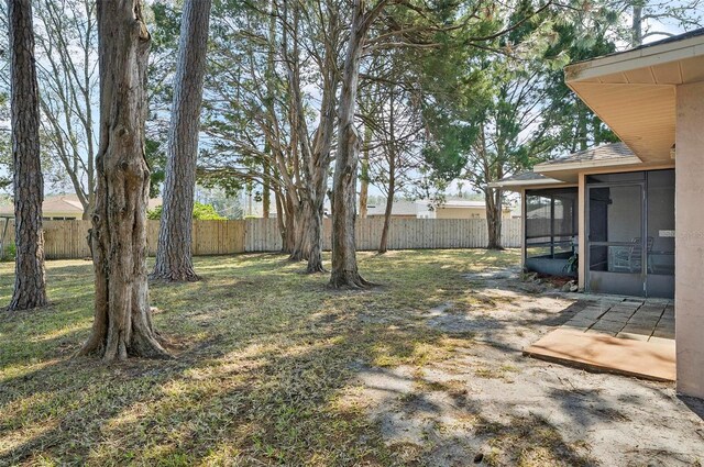 view of yard featuring a sunroom