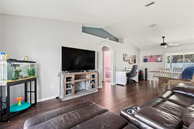 living room with dark hardwood / wood-style flooring, ceiling fan, and lofted ceiling