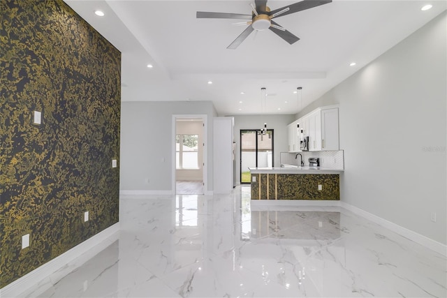 20 Pine Hill Ln, Palm Coast, FL 32164 - unfurnished living room with baseboards, an accent wall, recessed lighting, and ceiling fan