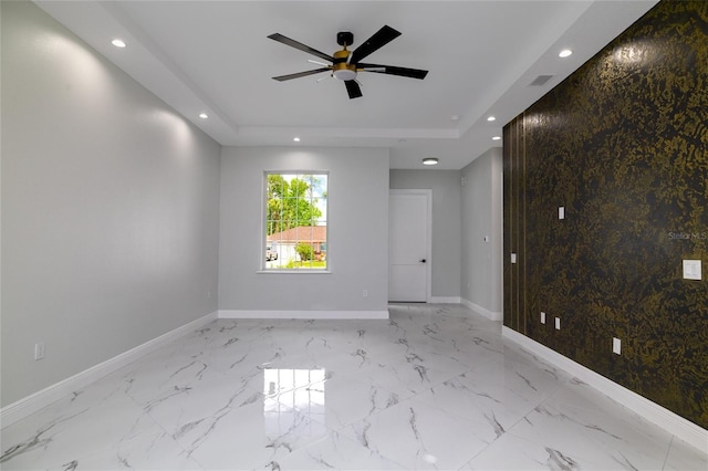 20 Pine Hill Ln, Palm Coast, FL 32164 - unfurnished room with baseboards, ceiling fan, a tray ceiling, and recessed lighting
