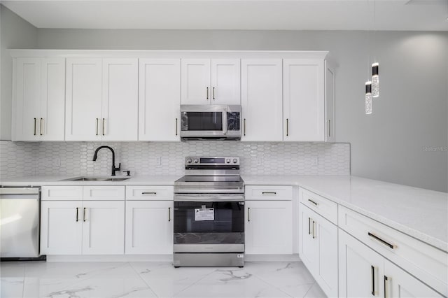 20 Pine Hill Ln, Palm Coast, FL 32164 - kitchen featuring light countertops, a sink, marble finish floor, and stainless steel appliances