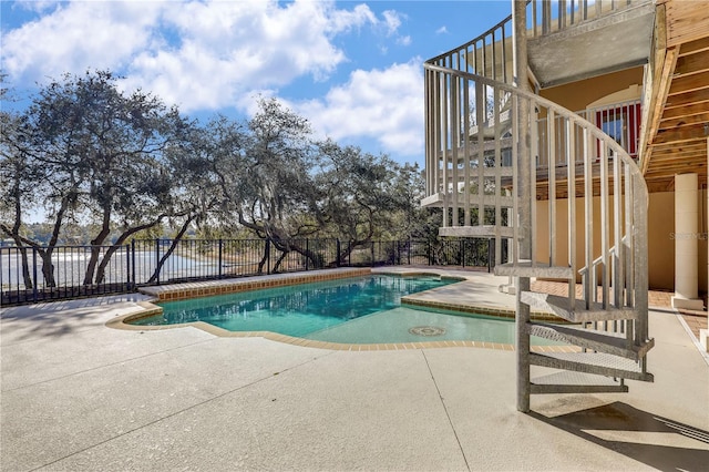 view of pool featuring a patio