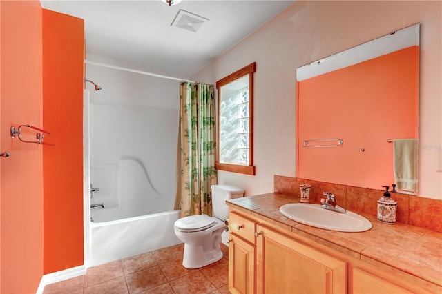 full bathroom featuring vanity, shower / bath combination with curtain, tile patterned floors, and toilet