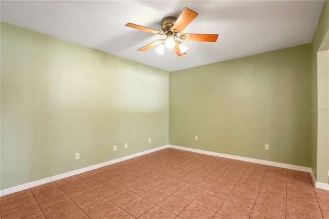 tiled empty room with ceiling fan