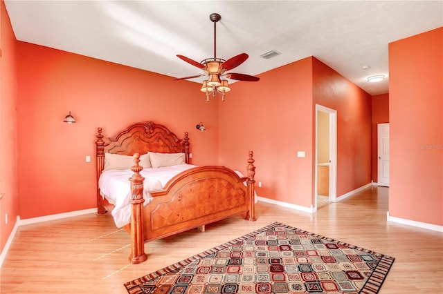 bedroom with hardwood / wood-style flooring and ceiling fan