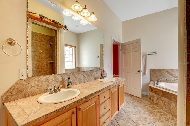 bathroom featuring tile patterned floors, vanity, separate shower and tub, and backsplash