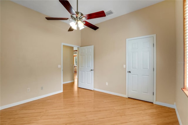 unfurnished bedroom with ceiling fan and light hardwood / wood-style flooring