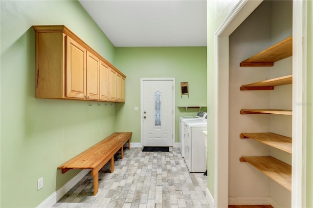 washroom with washing machine and clothes dryer