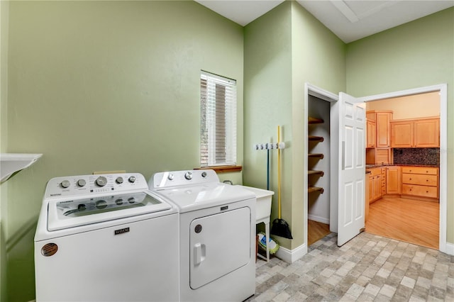 laundry room with separate washer and dryer