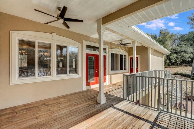 wooden deck featuring ceiling fan