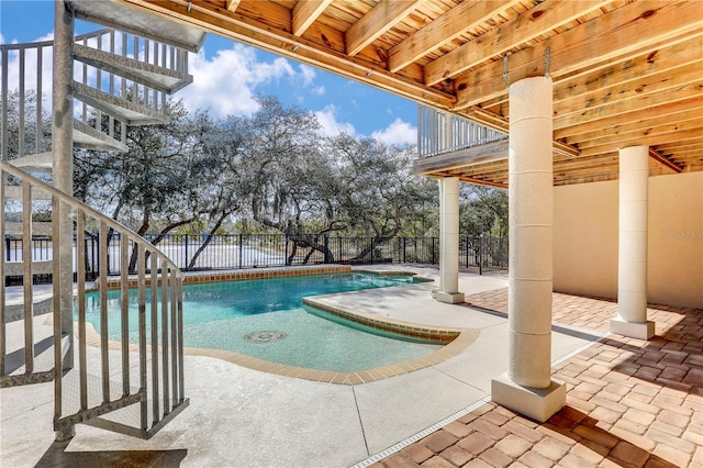 view of swimming pool with a patio area