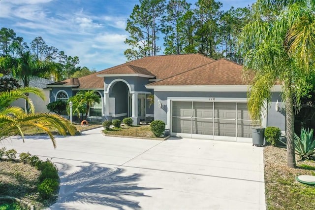 mediterranean / spanish-style house featuring a garage