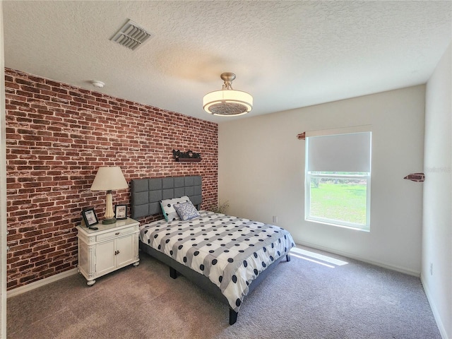 carpeted bedroom featuring vaulted ceiling, a textured ceiling, and brick wall