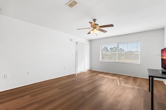 spare room with hardwood / wood-style flooring and ceiling fan