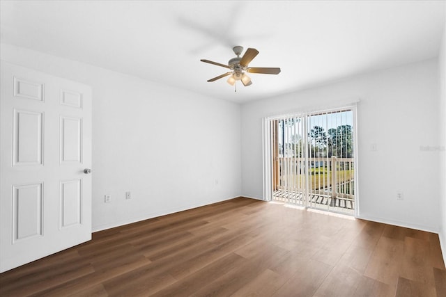 unfurnished room with dark hardwood / wood-style floors and ceiling fan