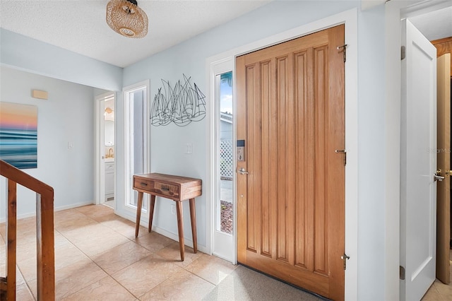 entryway featuring a textured ceiling