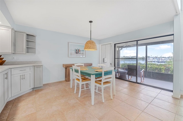 dining room featuring a water view