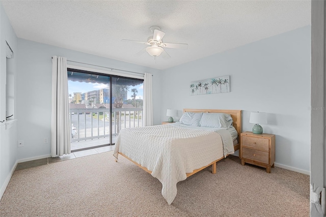 carpeted bedroom featuring ceiling fan, access to outside, and a textured ceiling