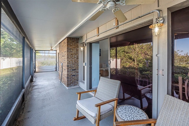 sunroom with a wealth of natural light and ceiling fan