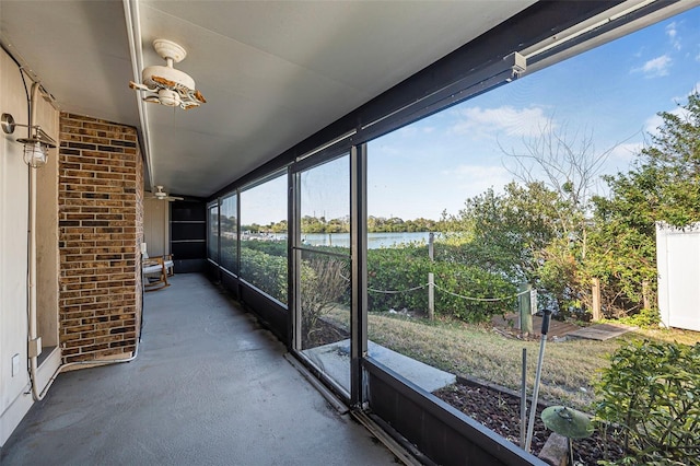 unfurnished sunroom with a water view