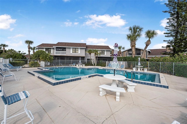 view of swimming pool with a patio area