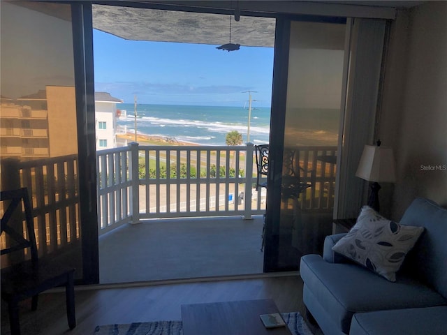 balcony with a water view and a beach view