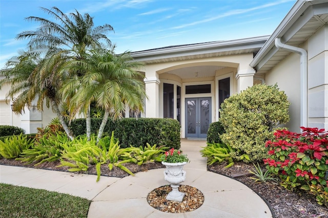 view of exterior entry featuring french doors