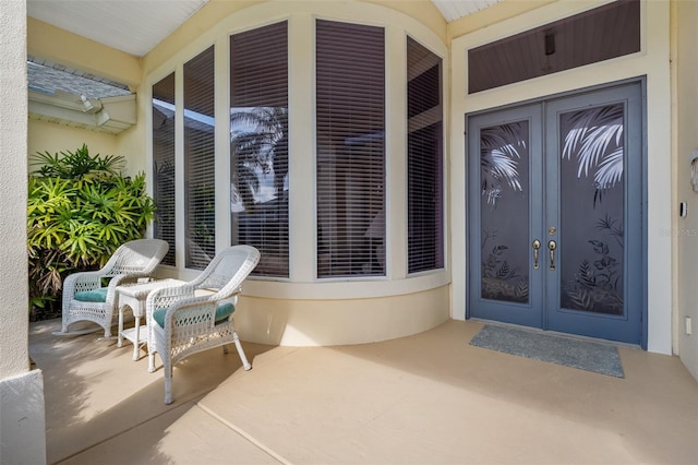 property entrance featuring french doors