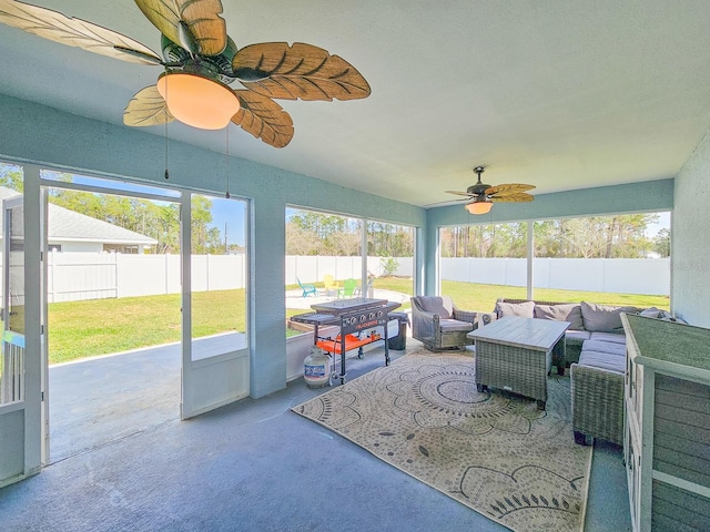 sunroom featuring a wealth of natural light and ceiling fan