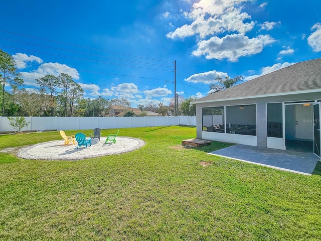 view of yard featuring a sunroom and a patio area