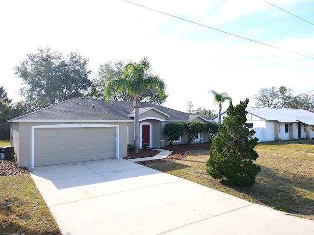 ranch-style house featuring a garage and a front yard