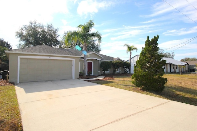 view of front of property featuring a garage and a front lawn